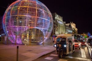 Christmas Lights Tour of Madrid in Eco Tuk Tuk Private - Plaza de Colón and the Columbus monument: lights over a 17-meter landmark