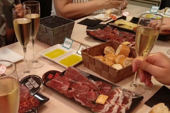 Iberian Ham and Wine Small Group Tour in Madrid - Stop One: classic tapas with two Spanish wines