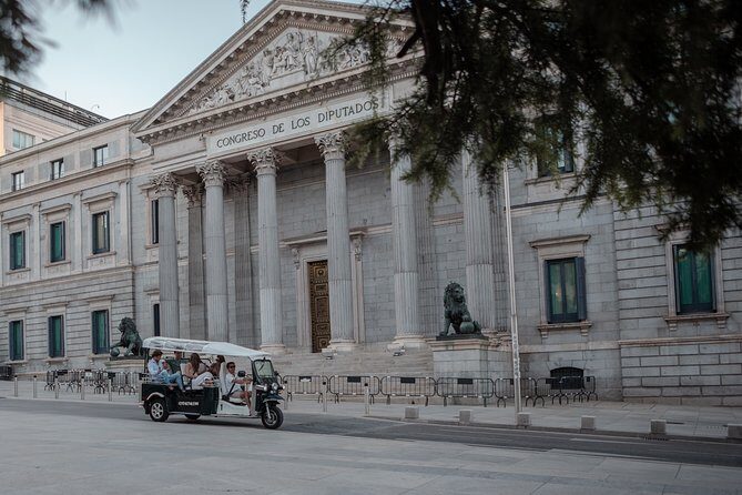 Madrid Expert Tour with Local Guide in Eco Tuk Tuk Private - Puerta de Alcalá, Neptune, and Cibeles: neoclassical Madrid in three icons