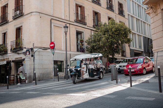 Madrid Historical Tour with Local Guide in Eco Tuk Tuk Private - Atocha station and the Palacio de las Cortes: where Madrid organizes power