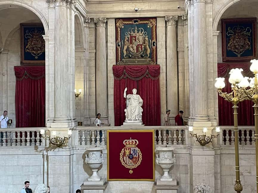 Madrid: Royal Palace Guided Tour with Entry Ticket - Entering the Royal Palace: entrance hall, main staircase, and the big “wow” moments