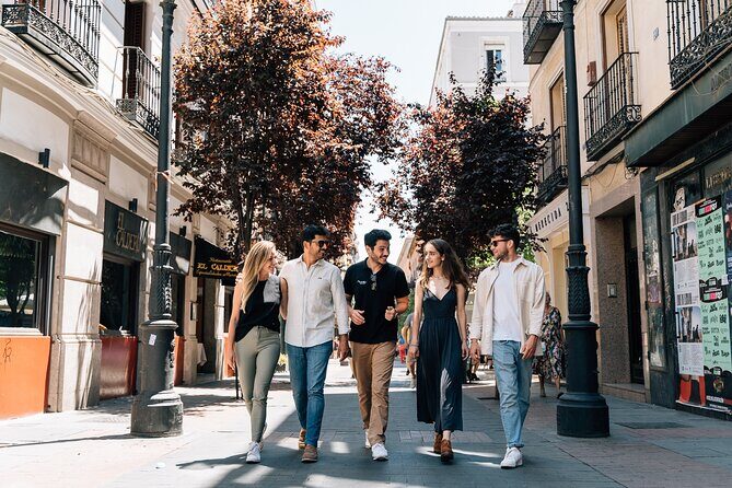 Madrid Tapas & Wine Tour with Rooftop Views and Local Guide - Stop 1 tasting: mushrooms and Padrón peppers with beer or cider